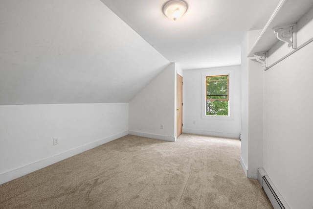 1 Fall St, Biddeford, ME 04005 - bonus room featuring carpet flooring, baseboard heating, vaulted ceiling, and baseboards