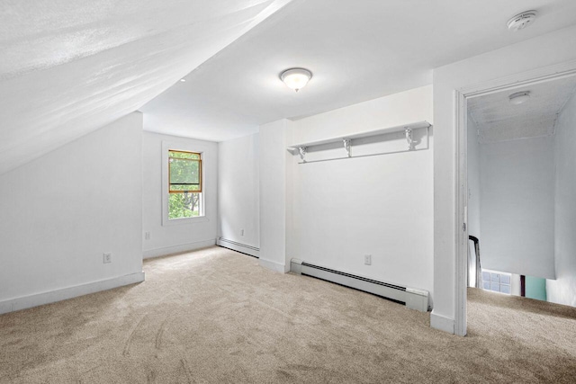 1 Fall St, Biddeford, ME 04005 - bonus room featuring a baseboard radiator, carpet, lofted ceiling, and baseboards