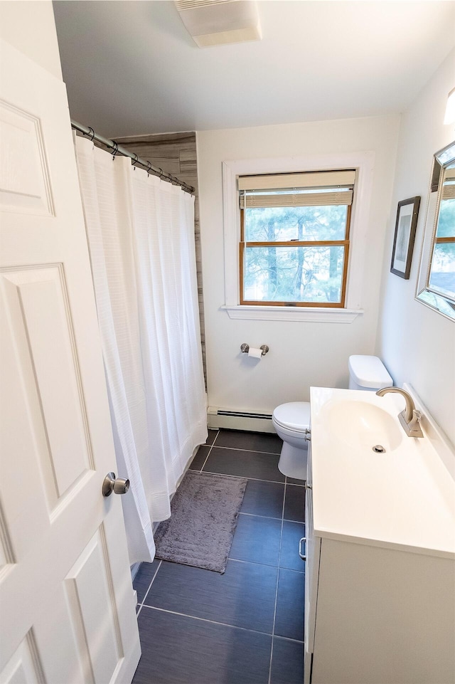 22 Penn Ave, Portland, ME 04103 - bathroom featuring a baseboard radiator, vanity, healthy amount of natural light, and toilet
