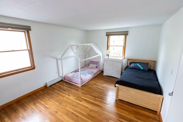 22 Penn Ave, Portland, ME 04103 - bedroom with light wood finished floors and baseboards