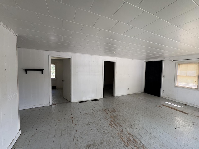 66 Pleasant St, Passadumkeag, ME 04461 - empty room featuring hardwood / wood-style floors and wooden walls