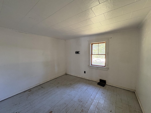 66 Pleasant St, Passadumkeag, ME 04461 - empty room featuring hardwood / wood-style floors and baseboards
