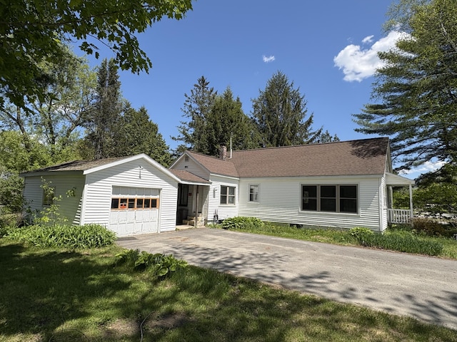 66 Pleasant St, Passadumkeag, ME 04461 - single story home with driveway, an outdoor structure, and a detached garage