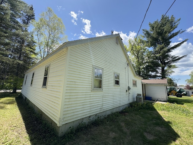 66 Pleasant St, Passadumkeag, ME 04461 - view of property exterior featuring a yard