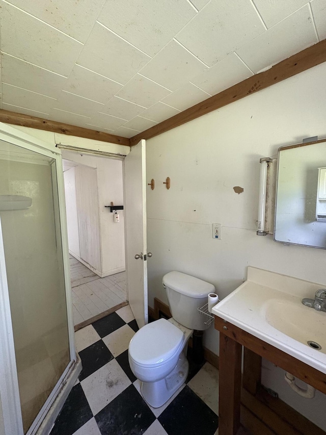 66 Pleasant St, Passadumkeag, ME 04461 - full bathroom featuring tile patterned floors, a shower stall, vanity, and toilet