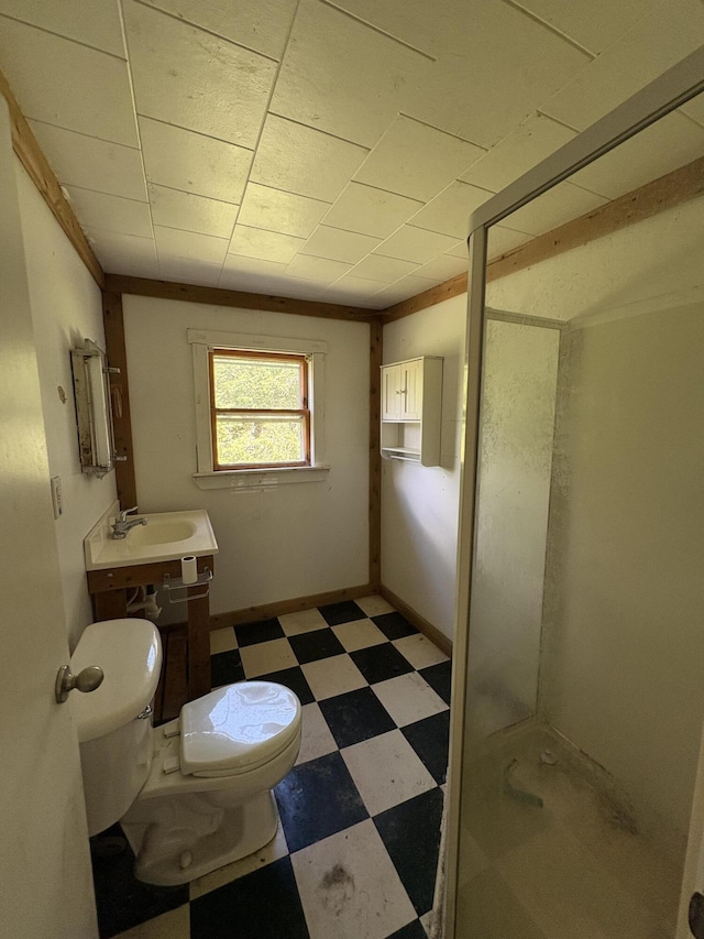 66 Pleasant St, Passadumkeag, ME 04461 - bathroom featuring tile patterned floors, toilet, a stall shower, and vanity