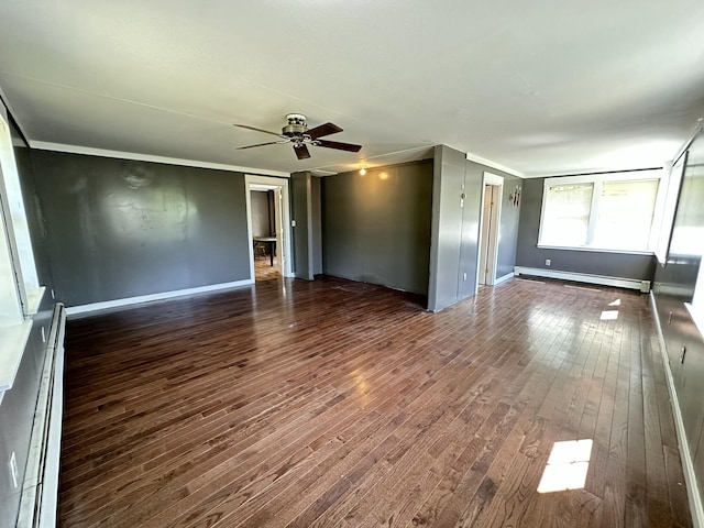 5 Grant Rd, Saint Albans, ME 04971 - empty room featuring a baseboard heating unit, dark wood finished floors, ceiling fan, and baseboards