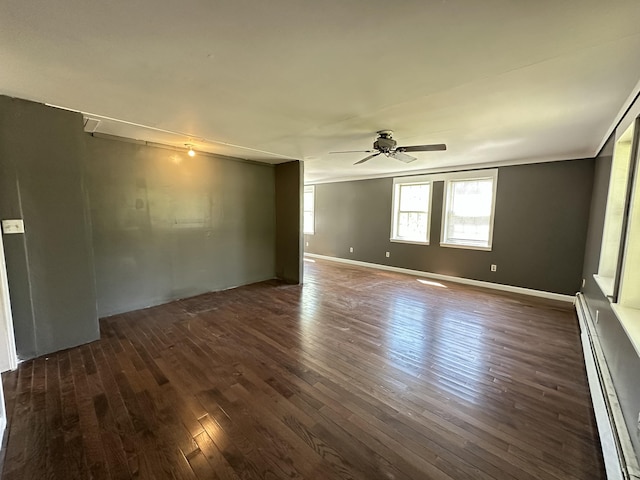 5 Grant Rd, Saint Albans, ME 04971 - empty room featuring ceiling fan, dark wood finished floors, and a baseboard heating unit