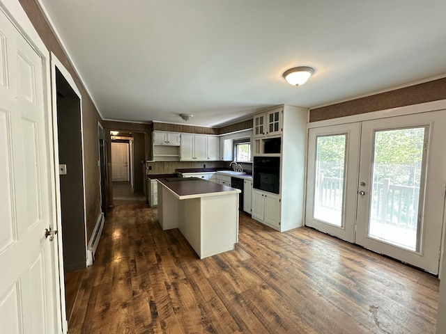 5 Grant Rd, Saint Albans, ME 04971 - kitchen featuring a kitchen island, french doors, dark wood-style floors, white cabinetry, and glass insert cabinets