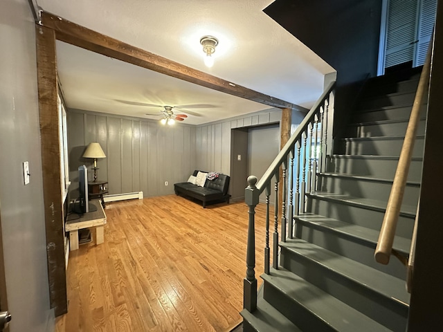 5 Grant Rd, Saint Albans, ME 04971 - staircase with baseboard heating, wood finished floors, a ceiling fan, and beamed ceiling