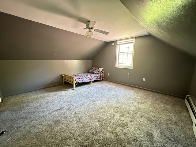 5 Grant Rd, Saint Albans, ME 04971 - unfurnished bedroom with carpet flooring, vaulted ceiling, a baseboard radiator, baseboards, and ceiling fan