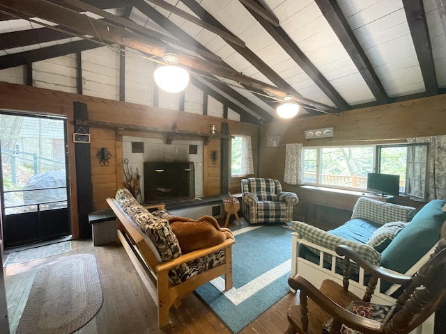 55 Sandy Bottom Rd, Turner, ME 04282 - living area featuring beam ceiling, wood-type flooring, and high vaulted ceiling