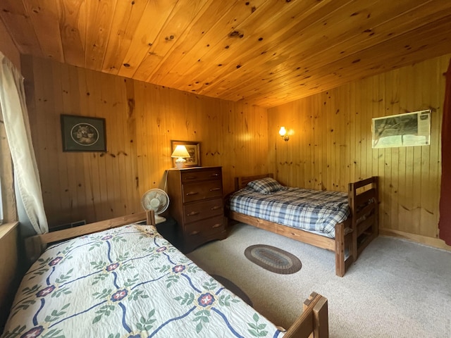 55 Sandy Bottom Rd, Turner, ME 04282 - carpeted bedroom with wood walls and wood ceiling