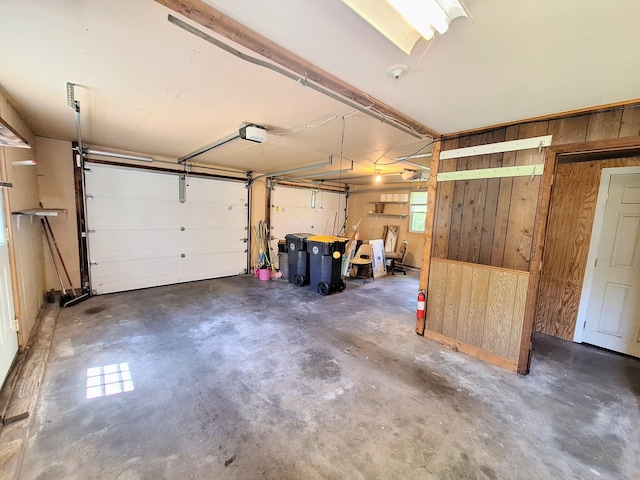 2 Gunstock Rd, Scarborough, ME 04074 - garage with wooden walls and a garage door opener
