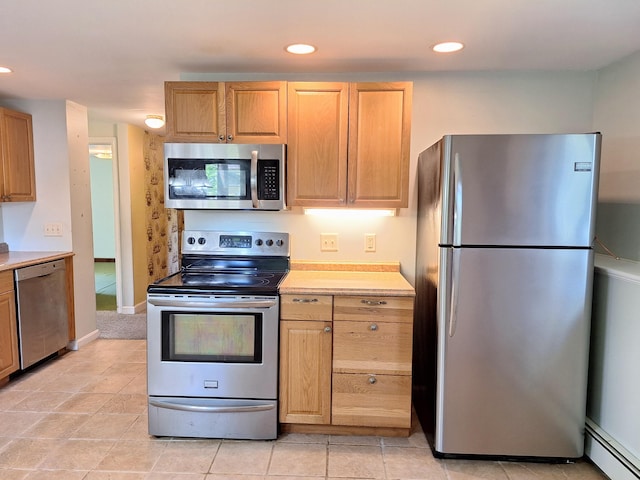 2 Gunstock Rd, Scarborough, ME 04074 - kitchen featuring appliances with stainless steel finishes, baseboard heating, light countertops, recessed lighting, and light tile patterned flooring