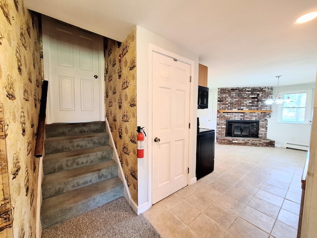 2 Gunstock Rd, Scarborough, ME 04074 - stairs featuring a baseboard radiator, wallpapered walls, a fireplace, baseboards, and tile patterned floors