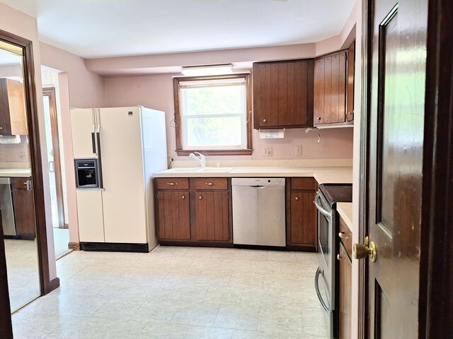 2 Gunstock Rd, Scarborough, ME 04074 - kitchen featuring stainless steel appliances, a sink, and light countertops