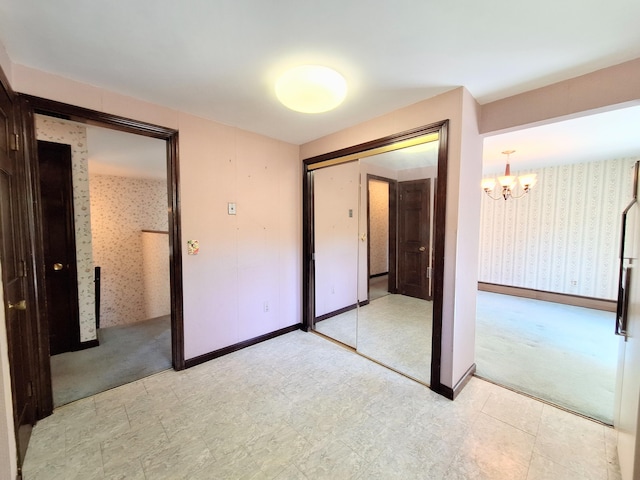 2 Gunstock Rd, Scarborough, ME 04074 - unfurnished bedroom with wallpapered walls, a chandelier, and a closet
