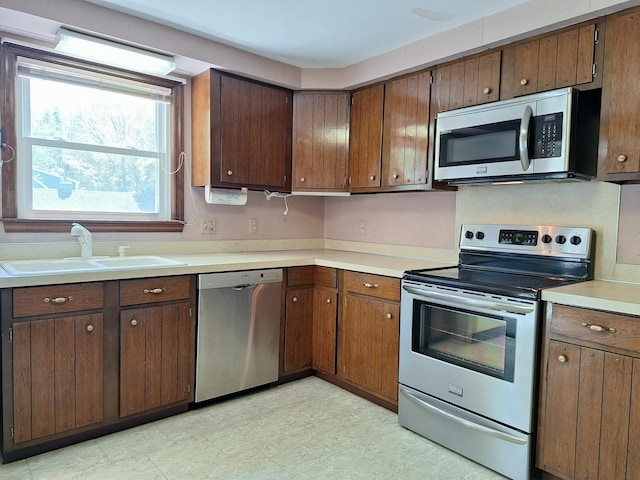 2 Gunstock Rd, Scarborough, ME 04074 - kitchen with appliances with stainless steel finishes, a sink, and light countertops