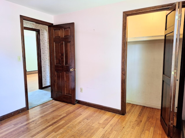 2 Gunstock Rd, Scarborough, ME 04074 - unfurnished bedroom featuring light wood finished floors, baseboards, a closet, and a baseboard radiator