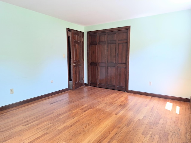 2 Gunstock Rd, Scarborough, ME 04074 - unfurnished bedroom with baseboards, light wood-type flooring, and a closet