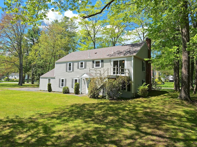 2 Gunstock Rd, Scarborough, ME 04074 - view of front facade featuring a chimney, a front yard, stairs, and a shingled roof