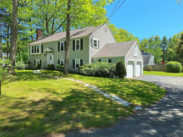 2 Gunstock Rd, Scarborough, ME 04074 - bi-level home featuring a chimney, asphalt driveway, an attached garage, and a shingled roof