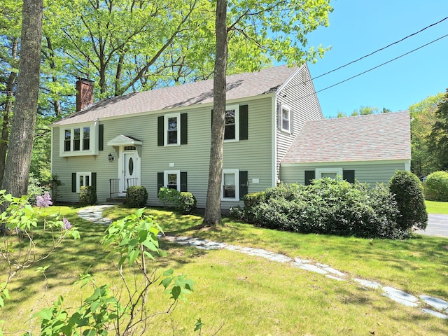 2 Gunstock Rd, Scarborough, ME 04074 - raised ranch featuring a chimney, a shingled roof, and a front yard