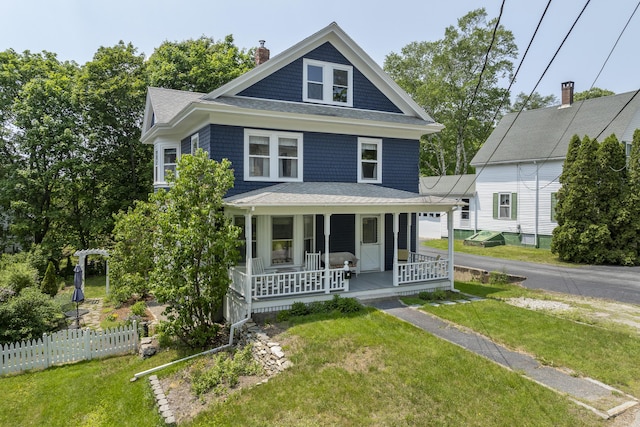 14 Fullerton St, Boothbay Harbor, ME 04538 - traditional style home featuring a porch, a chimney, and roof with shingles