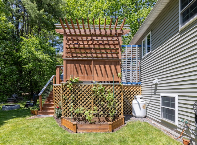 13 Daggett St, Portland, ME 04103 - view of green lawn with a garden and stairway