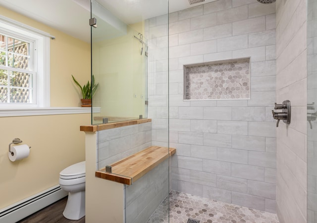 13 Daggett St, Portland, ME 04103 - full bathroom with a baseboard radiator, a walk in shower, and toilet