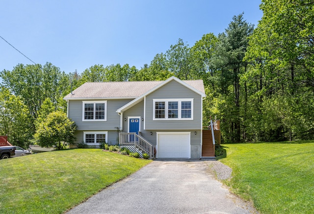 13 Daggett St, Portland, ME 04103 - split foyer home with an attached garage, asphalt driveway, a front lawn, and a shingled roof