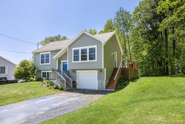 13 Daggett St, Portland, ME 04103 - split foyer home with stairway, asphalt driveway, a front yard, an attached garage, and roof with shingles