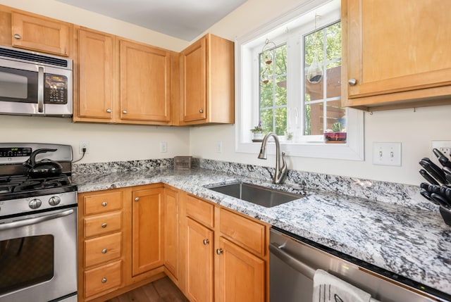 13 Daggett St, Portland, ME 04103 - kitchen with appliances with stainless steel finishes, a sink, light stone countertops, and dark wood finished floors