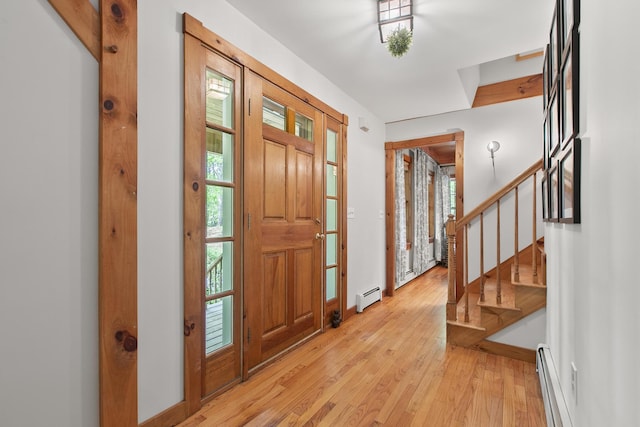 58 Josiah Norton Rd, York, ME 03902 - foyer entrance with a baseboard heating unit, light wood-style flooring, stairway, a baseboard radiator, and baseboards