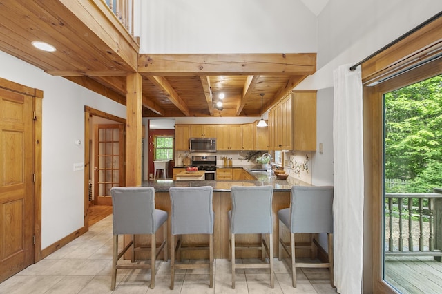 58 Josiah Norton Rd, York, ME 03902 - kitchen with appliances with stainless steel finishes, a sink, wood ceiling, a peninsula, and a kitchen bar