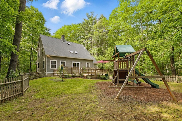 58 Josiah Norton Rd, York, ME 03902 - back of property with a playground, a wooden deck, and a shingled roof