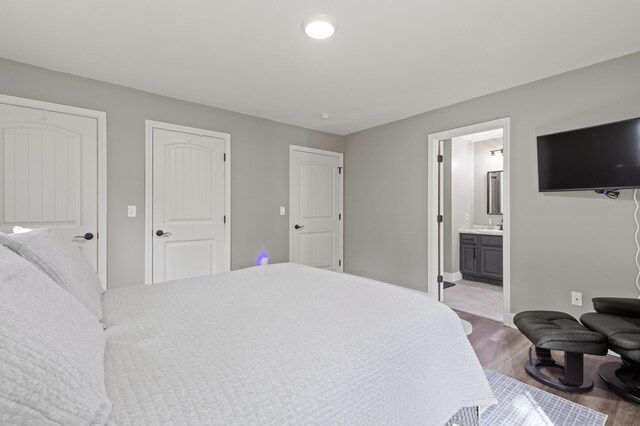 186 Yarmouth Rd, Gray, ME 04039 - bedroom featuring wood finished floors, baseboards, and ensuite bathroom