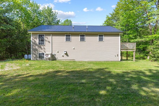 186 Yarmouth Rd, Gray, ME 04039 - back of house featuring a yard, metal roof, and a deck