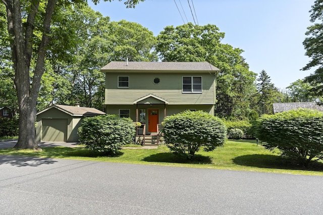 23 Stovers Point Rd, Harpswell, ME 04079 - colonial home with an outbuilding, a garage, and a front yard