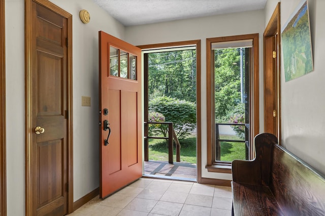 23 Stovers Point Rd, Harpswell, ME 04079 - foyer entrance with light tile patterned floors and a textured ceiling
