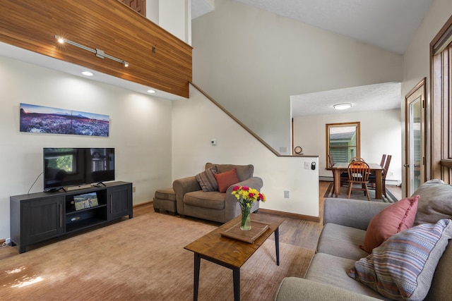 23 Stovers Point Rd, Harpswell, ME 04079 - living room featuring light wood-type flooring, stairs, recessed lighting, and high vaulted ceiling