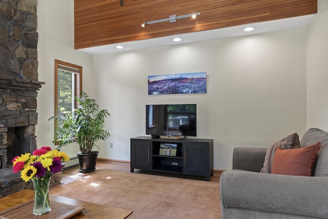 23 Stovers Point Rd, Harpswell, ME 04079 - living room with wood finished floors, a fireplace, baseboard heating, and recessed lighting