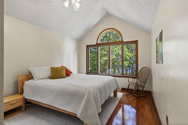 23 Stovers Point Rd, Harpswell, ME 04079 - bedroom featuring lofted ceiling, wood finished floors, a textured ceiling, and a ceiling fan