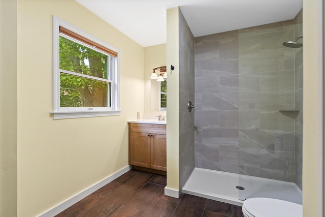 23 Stovers Point Rd, Harpswell, ME 04079 - bathroom with a tile shower, vanity, and wood finished floors