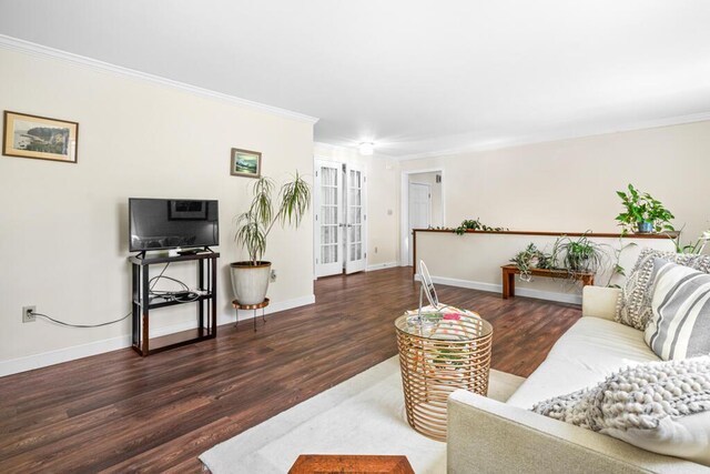 6 Winter St, Augusta, ME 04330 - living area with wood finished floors, baseboards, crown molding, and french doors