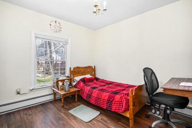 6 Winter St, Augusta, ME 04330 - bedroom featuring wood finished floors, a baseboard radiator, and a chandelier