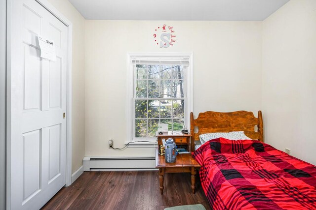 6 Winter St, Augusta, ME 04330 - bedroom featuring a baseboard heating unit, wood finished floors, and baseboards