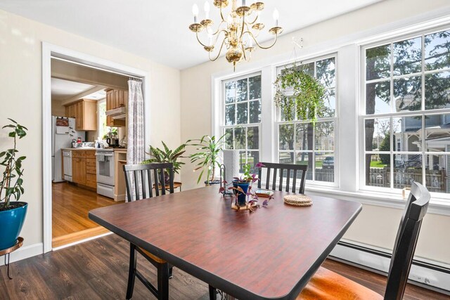 6 Winter St, Augusta, ME 04330 - dining space with a baseboard radiator, wood finished floors, and a chandelier