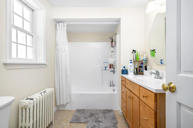 6 Winter St, Augusta, ME 04330 - bathroom with radiator heating unit, vanity, shower / bath combo, tile patterned flooring, and toilet